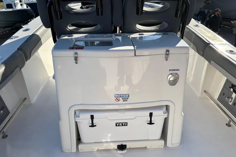 Slide: The Image of 2023 NauticStar 28 XS boat interior with Yeti cooler and seating. - 14