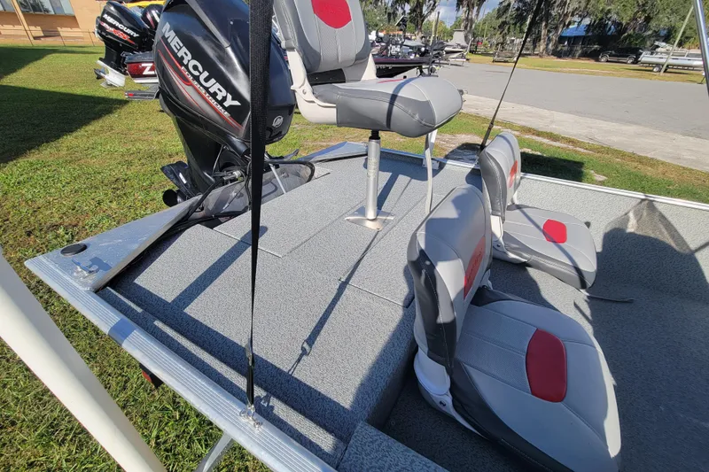 Slide: The Image of 2016 Tracker Pro 160 boat interior with Mercury engine and seating. - 10
