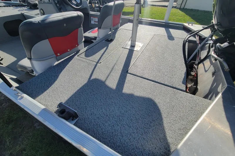 Slide: The Image of 2016 Tracker Pro 160 boat interior with seating and deck view. - 11