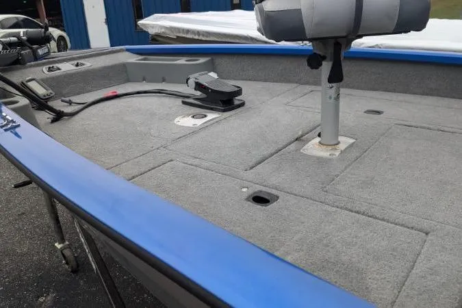 Slide: The Image of 2011 Bass Tracker PRO TEAM 175 TF boat interior with gray carpet and seating. - 8