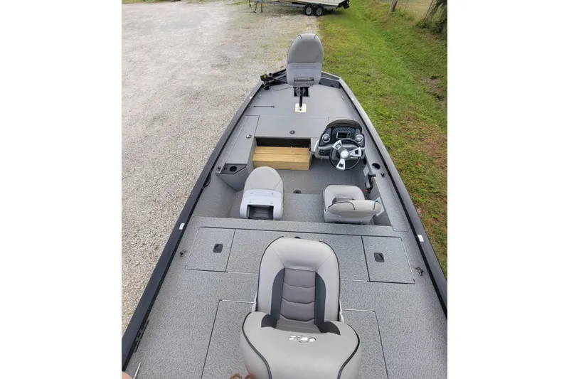 Slide: The Image of 2019 G3 Sportsman 1610 boat interior with steering console and seating. - 3