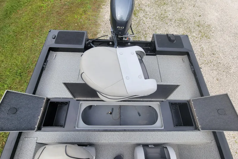 Slide: The Image of 2019 G3 Sportsman 1610 boat interior with seating and storage compartments. - 4