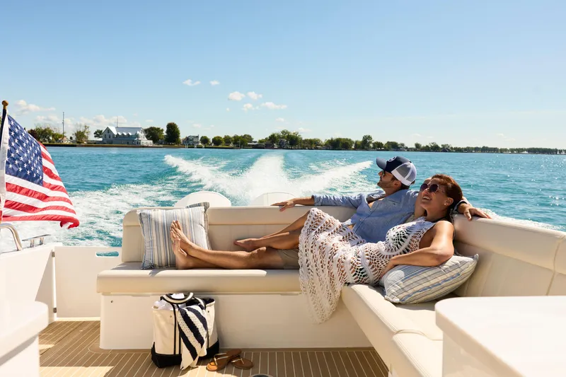 Slide: The Image of Couple relaxing on MJM 47X boat, 2026 model, cruising on a sunny day. - 6