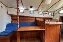 Slide: The Image of Interior of 1974 Colvin Gazelle Custom boat with blue seating and wooden accents. - 12