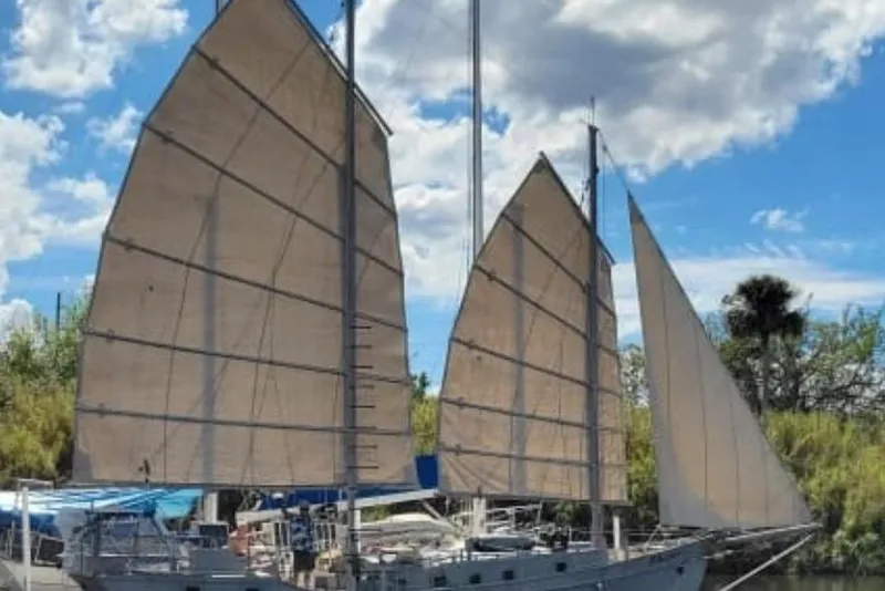 Slide: The Image of Tall mast of 1974 Colvin Gazelle Custom sailboat against blue sky. - 2