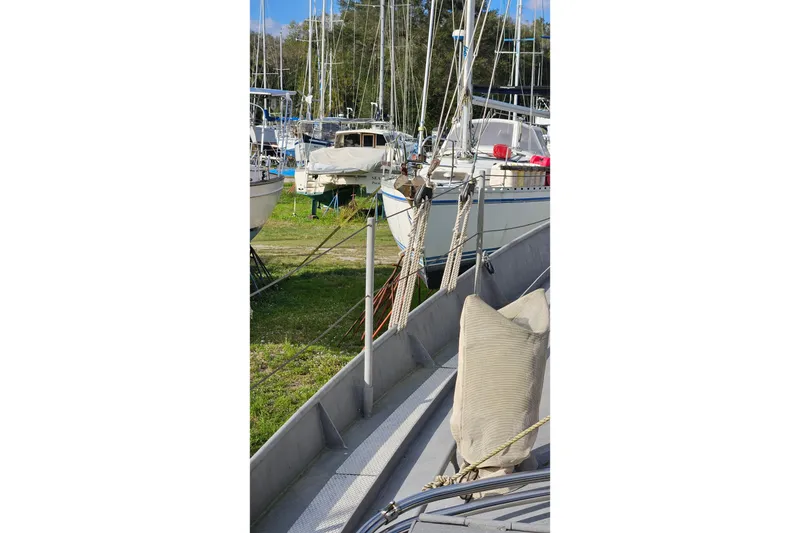 Slide: The Image of 1974 Colvin Gazelle Custom sailboat docked among other boats in a marina. - 21