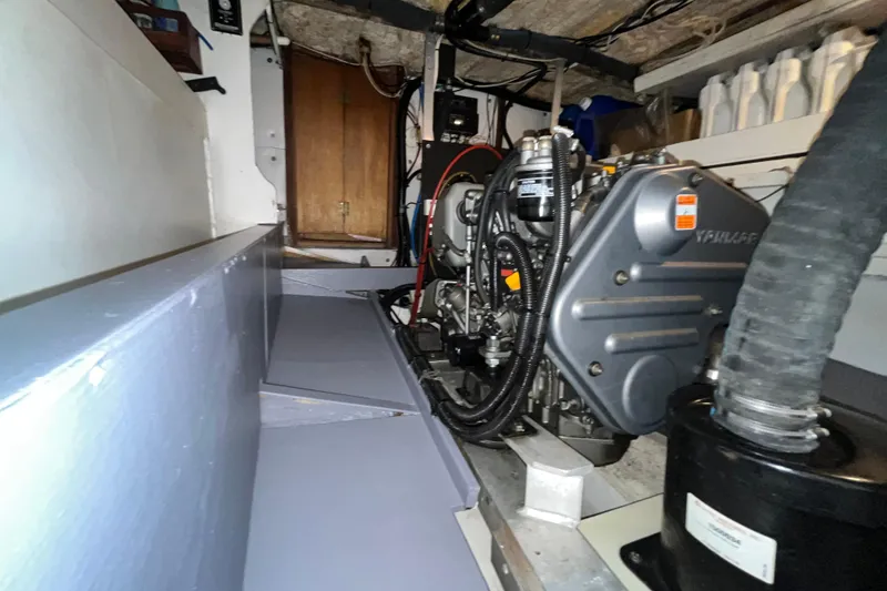 Slide: The Image of Engine room of a 1974 Colvin Gazelle Custom boat, featuring a Yanmar engine. - 24
