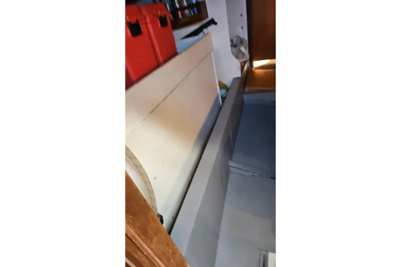 Slide: The Image of Interior of a 1974 Colvin Gazelle Custom boat with storage compartments. - 27