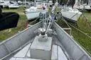Slide: The Image of Bow of 1974 Colvin Gazelle Custom sailboat in a boatyard, surrounded by other vessels. - 3