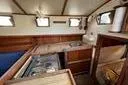 Slide: The Image of 1974 Colvin Gazelle Custom sailboat deck with open hatch and visible interior. - 4