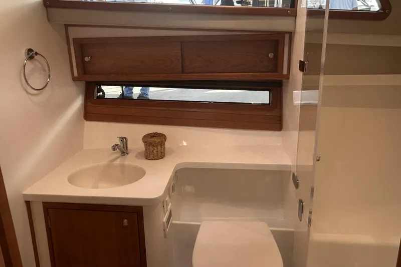Slide: The Image of Modern bathroom interior of 2026 MJM 47R yacht with sink, cabinet, and window. - 3