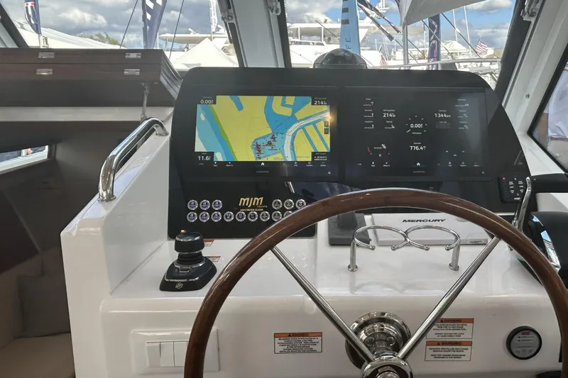 Slide: The Image of Helm of 2026 MJM 47R boat with navigation display and controls. - 5