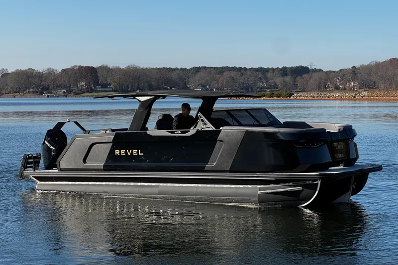 Slide: The Image of 2026 Revel RS25L luxury pontoon boat on a serene lake. - 7