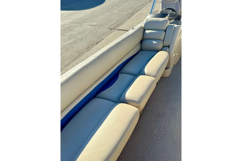 Slide: The Image of 2012 Regency Sun Tracker Party Barge with beige seating and blue accents. - 12