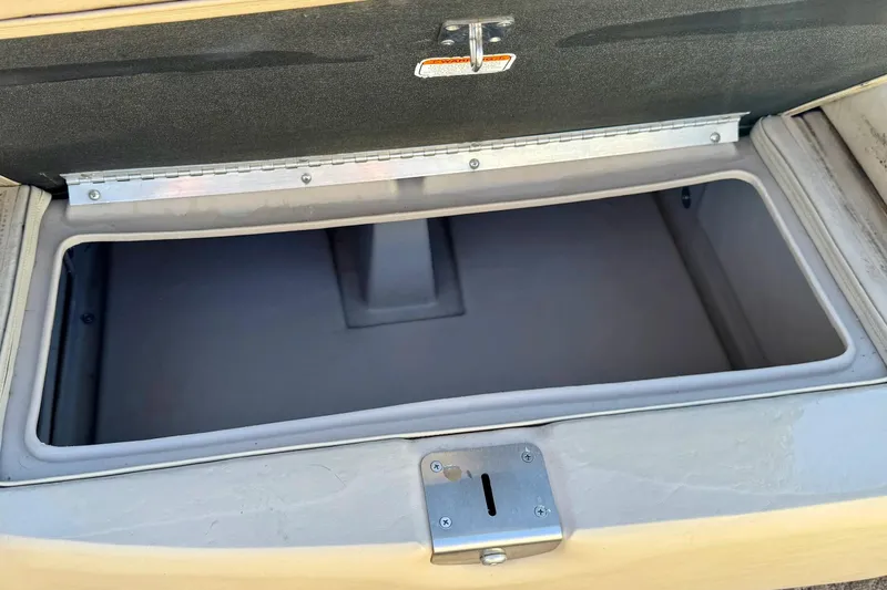 Slide: The Image of Open storage compartment on 2012 Regency Sun Tracker Party Barge boat. - 15