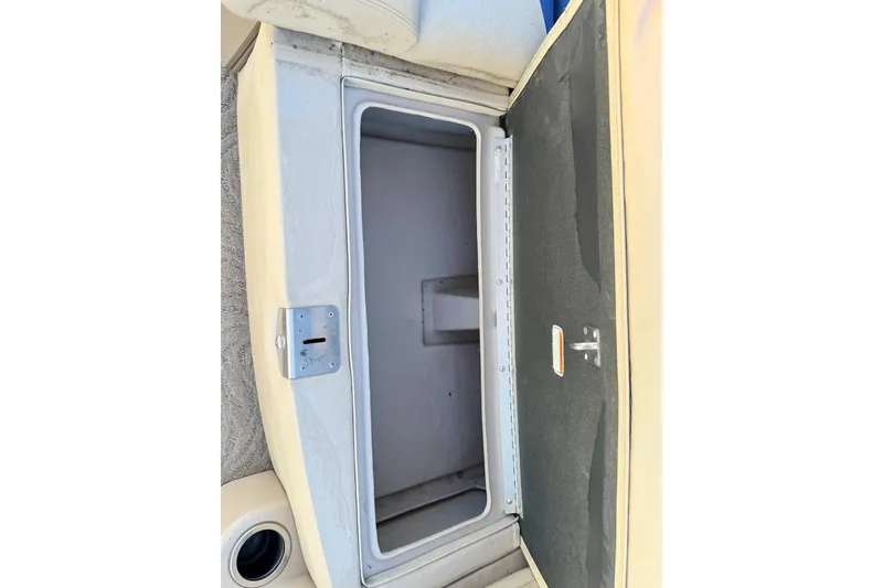 Slide: The Image of Open storage compartment on 2012 Regency Sun Tracker Party Barge boat. - 16