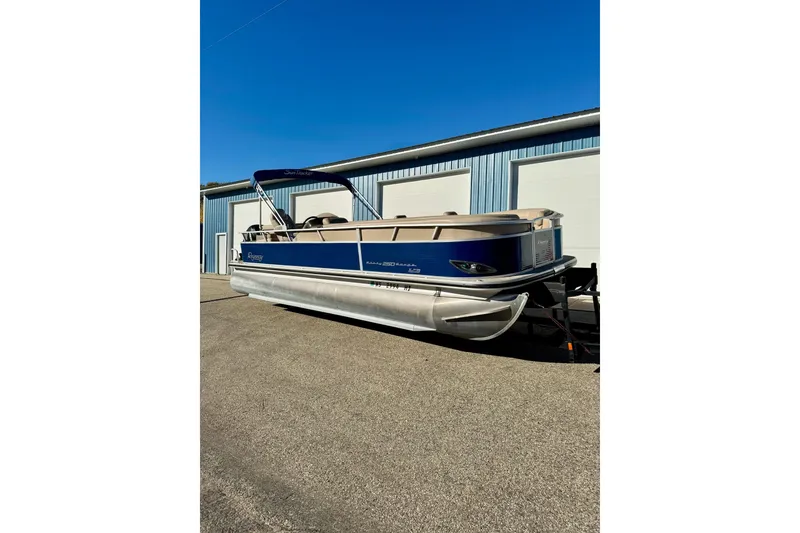 Slide: The Image of 2012 Regency Sun Tracker Party Barge pontoon boat parked outdoors. - 2