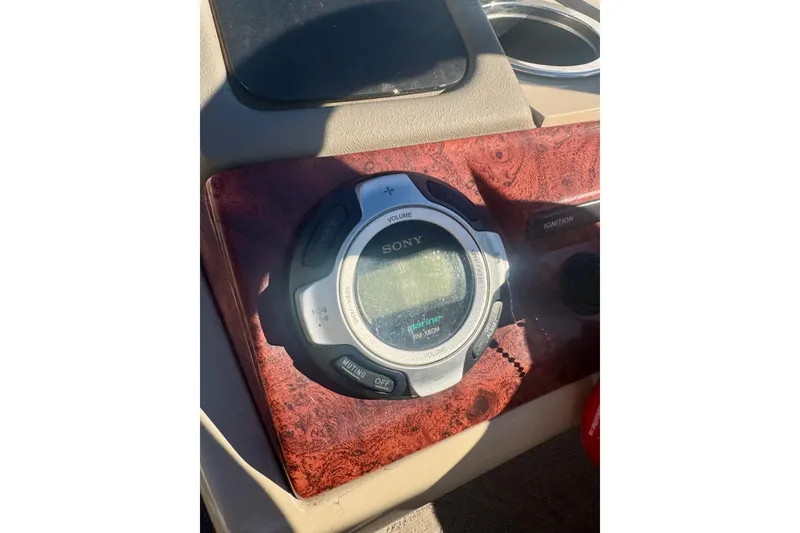 Slide: The Image of Sony marine stereo on 2012 Regency Sun Tracker Party Barge dashboard. - 20