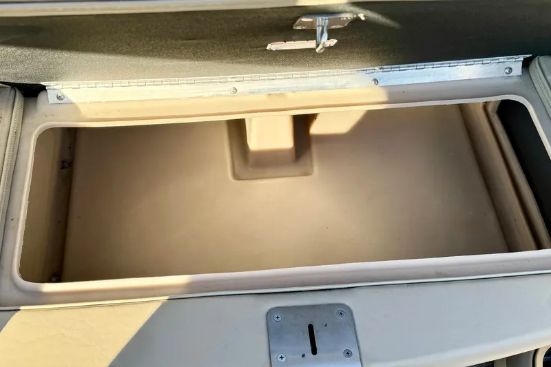 Slide: The Image of Open storage compartment on 2012 Regency Sun Tracker Party Barge boat. - 28