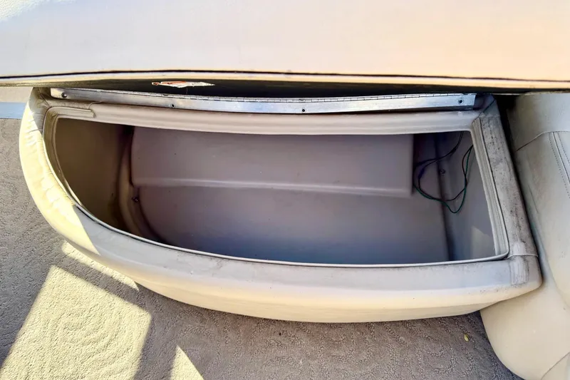 Slide: The Image of Open storage compartment on 2012 Regency Sun Tracker Party Barge boat. - 31