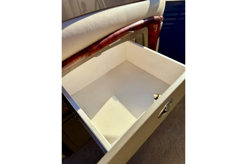 Slide: The Image of Open storage compartment in 2012 Regency Sun Tracker Party Barge boat. - 34
