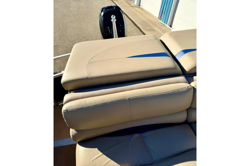 Slide: The Image of 2012 Regency Sun Tracker Party Barge with beige and blue cushioned seating. - 37