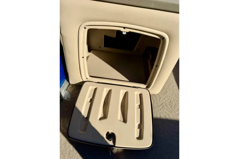 Slide: The Image of Open storage compartment on 2012 Regency Sun Tracker Party Barge boat. - 43