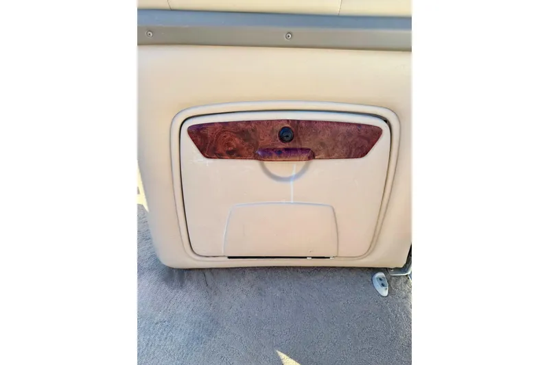 Slide: The Image of 2012 Regency Sun Tracker Party Barge storage compartment with wood accent. - 44