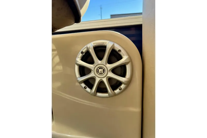 Slide: The Image of Speaker on 2012 Regency Sun Tracker Party Barge, featuring sleek silver design. - 49