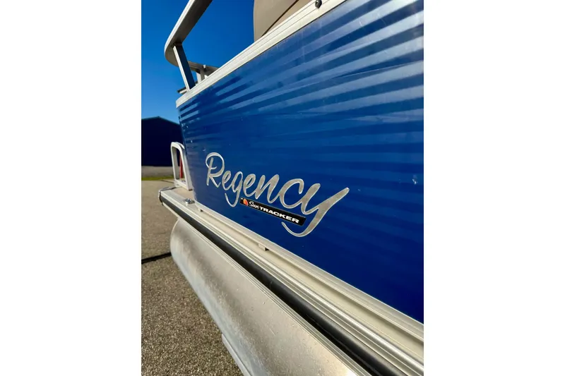 Slide: The Image of 2012 Regency Sun Tracker Party Barge, blue exterior detail in sunlight. - 7