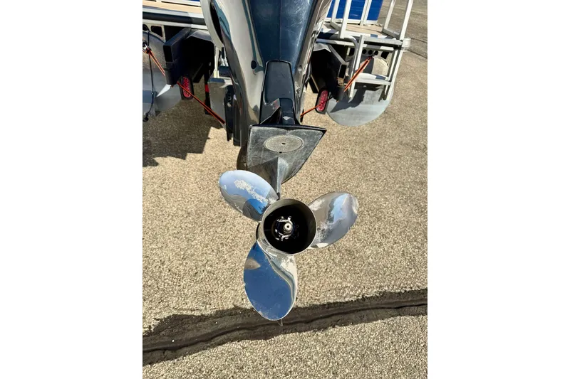 Slide: The Image of Propeller of 2012 Regency Sun Tracker Party Barge on pavement background. - 9