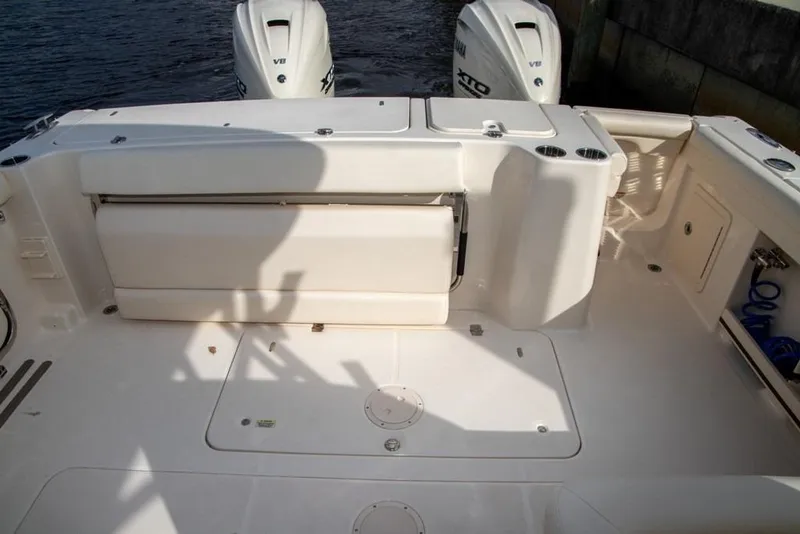 Slide: The Image of 2024 Grady-White Freedom 335 boat deck with dual outboard engines. - 15