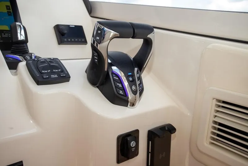 Slide: The Image of 2024 Grady-White Freedom 335 boat controls with modern dashboard features. - 29