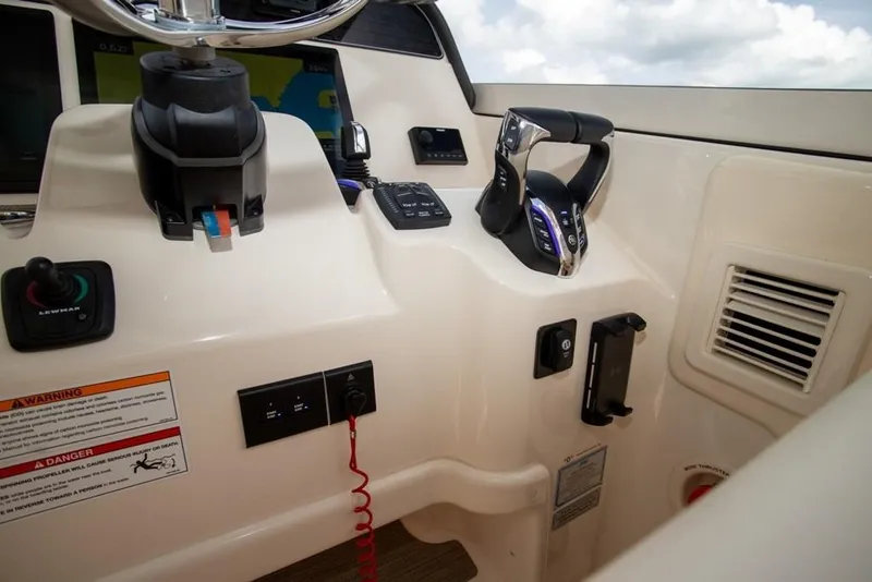Slide: The Image of 2024 Grady-White Freedom 335 boat helm with controls and navigation equipment. - 30