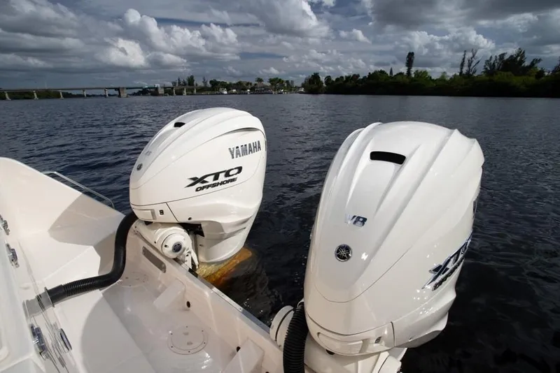 Slide: The Image of 2024 Grady-White Freedom 335 with Yamaha XTO Offshore engines on a calm waterway. - 37