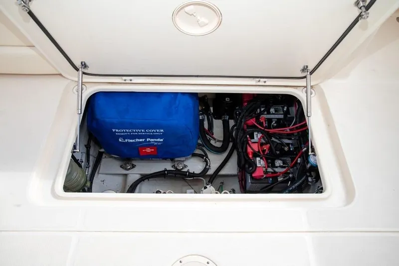 Slide: The Image of 2024 Grady-White Freedom 335 engine compartment with Fischer Panda generator and wiring. - 41