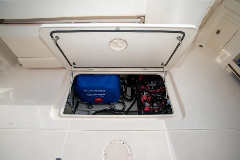 Slide: The Image of 2024 Grady-White Freedom 335 boat compartment with protective cover and wiring. - 42