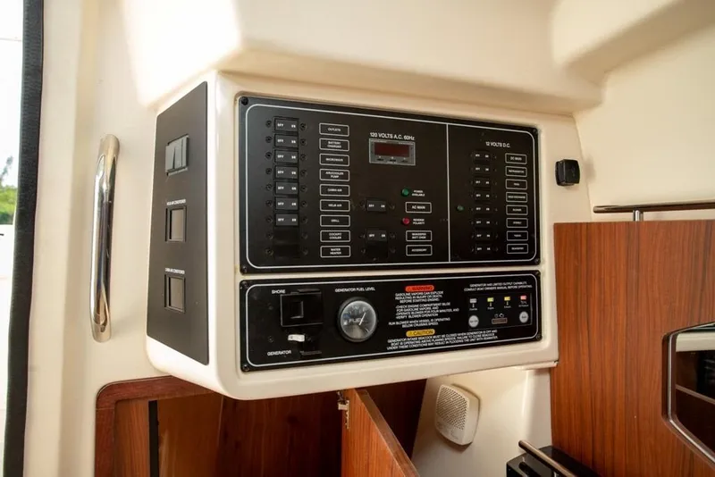 Slide: The Image of 2024 Grady-White Freedom 335 electrical control panel with switches and indicators. - 52