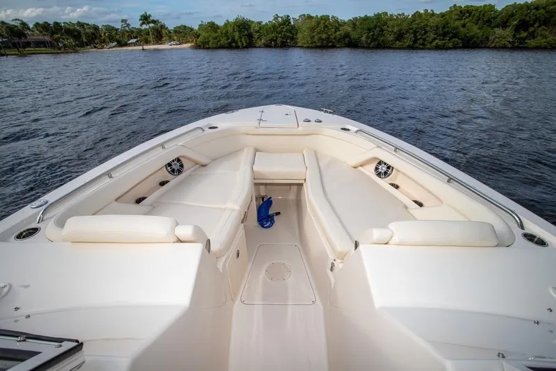 Slide: The Image of 2024 Grady-White Freedom 335 boat interior with spacious seating on the water. - 58