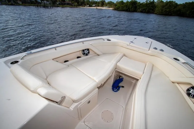 Slide: The Image of 2024 Grady-White Freedom 335 boat interior with luxurious seating on the water. - 59