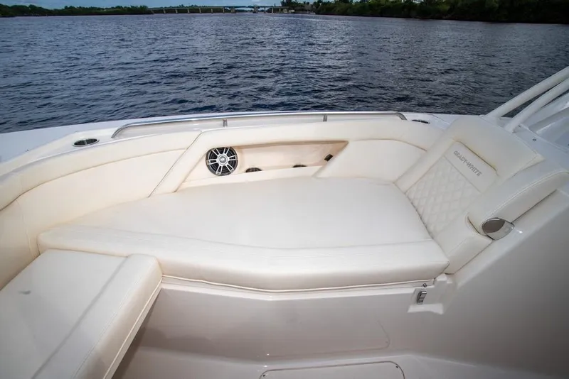 Slide: The Image of 2024 Grady-White Freedom 335 boat with luxurious seating and scenic water view. - 61