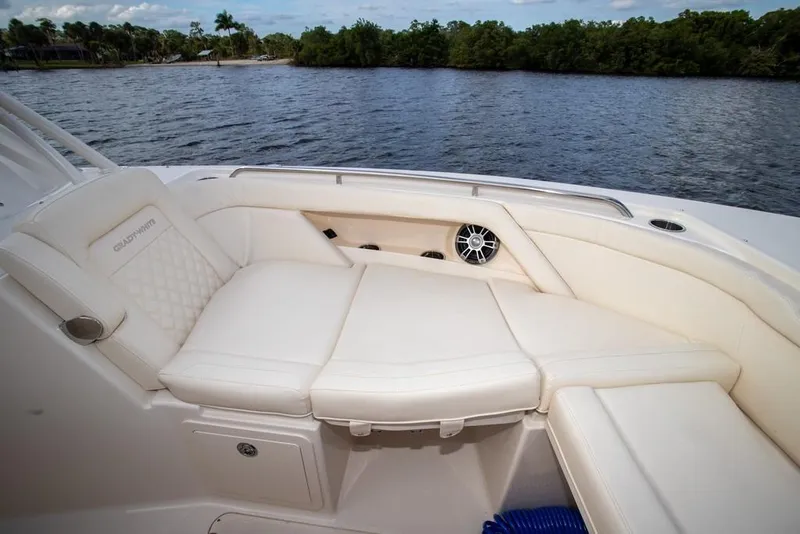 Slide: The Image of 2024 Grady-White Freedom 335 boat interior with luxurious seating by the water. - 62