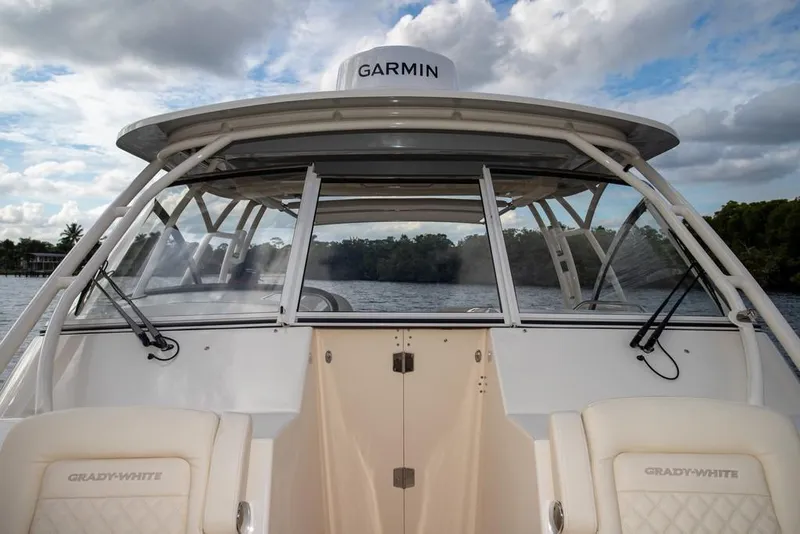 Slide: The Image of 2024 Grady-White Freedom 335 boat with Garmin equipment on a scenic waterway. - 64