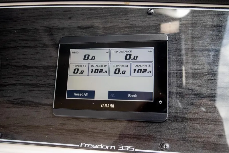 Slide: The Image of Yamaha display on 2024 Grady-White Freedom 335 boat dashboard showing trip data. - 66