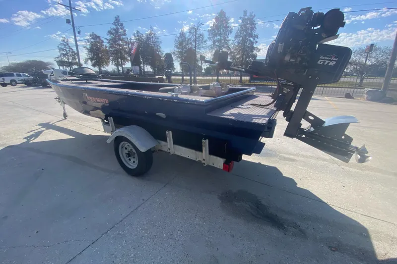 Slide: The Image of 2014 Cottonmouth 18x60 boat on trailer with Gator-Tail GTR motor in parking lot. - 7