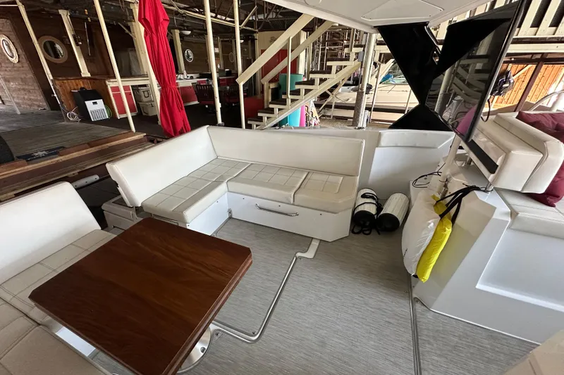 Slide: The Image of 2021 Cruisers Yachts 390 Express Coupe docked in a marina. - 21