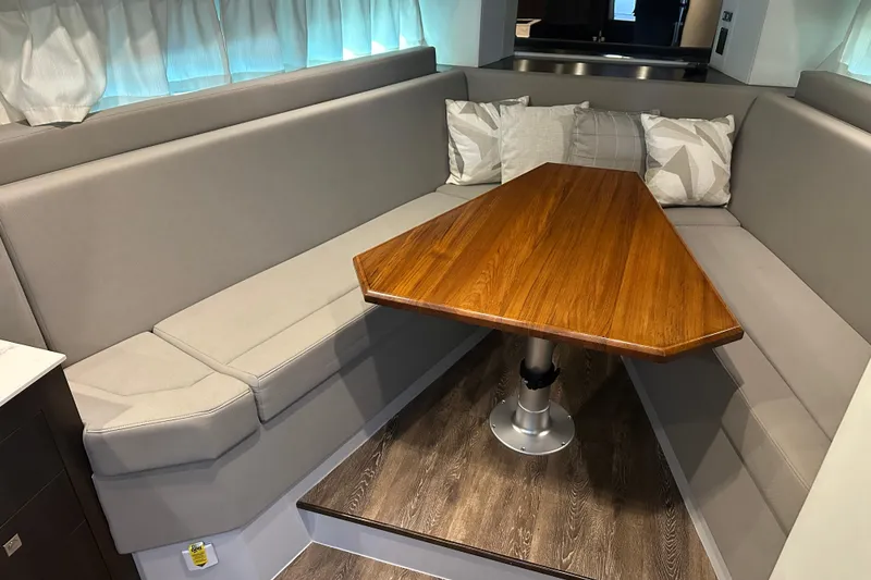 Slide: The Image of 2021 Cruisers Yachts 390 Express Coupe helm with navigation displays and controls. - 29