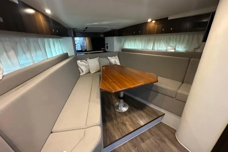 Slide: The Image of Control panel of 2021 Cruisers Yachts 390 Express Coupe with navigation and throttle systems. - 31