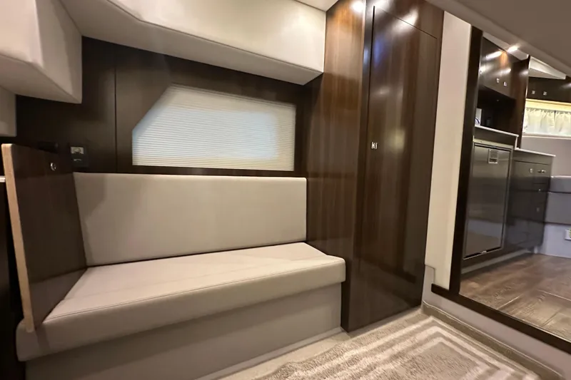 Slide: The Image of Luxurious interior of 2021 Cruisers Yachts 390 Express Coupe with modern kitchen amenities. - 47