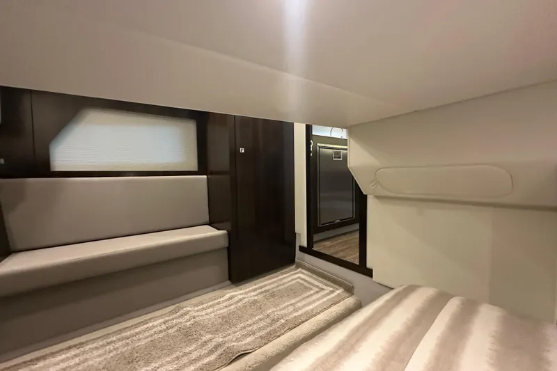 Slide: The Image of Interior of 2021 Cruisers Yachts 390 Express Coupe, featuring modern seating and elegant design. - 63
